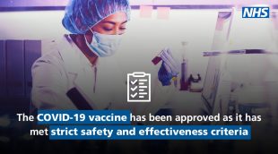 'The COVID-19 vaccine has been approved as it has met strict safety and effectiveness criteria' is written under an image of a woman scientist wearing a mask and holding a test tube.