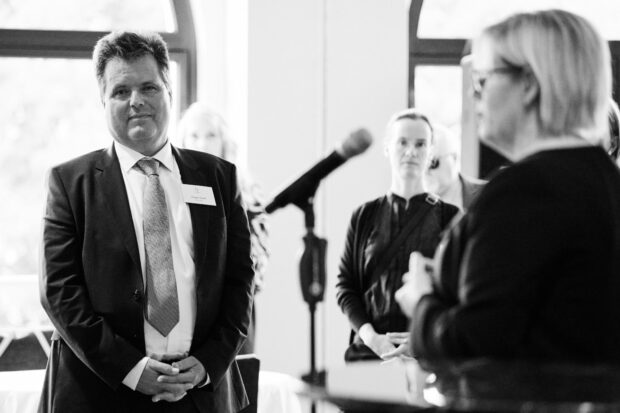 Minister Qualtrough is pictured giving her keynote speech as Commissioner Dusel looks on.